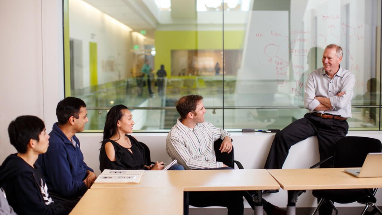 Researcher Allan Balmain, PhD, FRS leads a collaborative discussion in the Helen Diller Family Cancer Research Building in Mission Bay. Photo by Steve Babuljak.