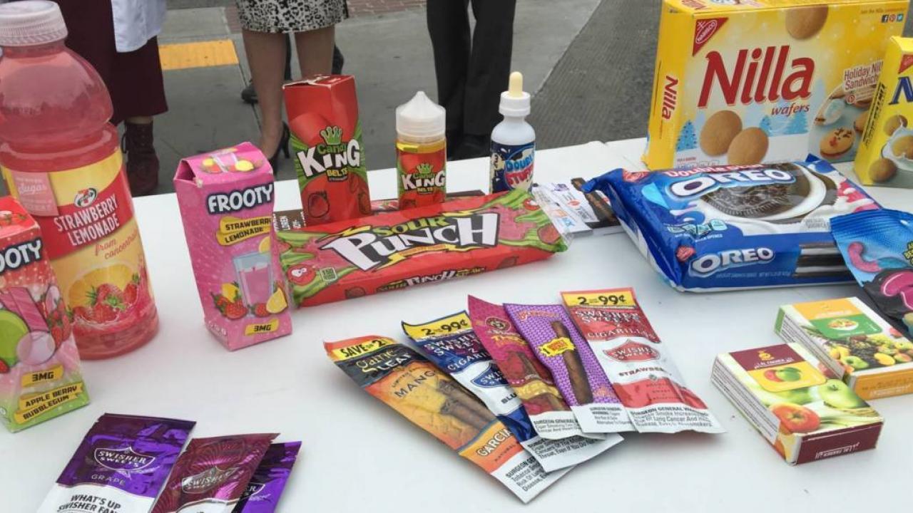 The candylike packaging for vaping products on display at a Yes-on-E rally. (Lesley McClurg/ KQED)