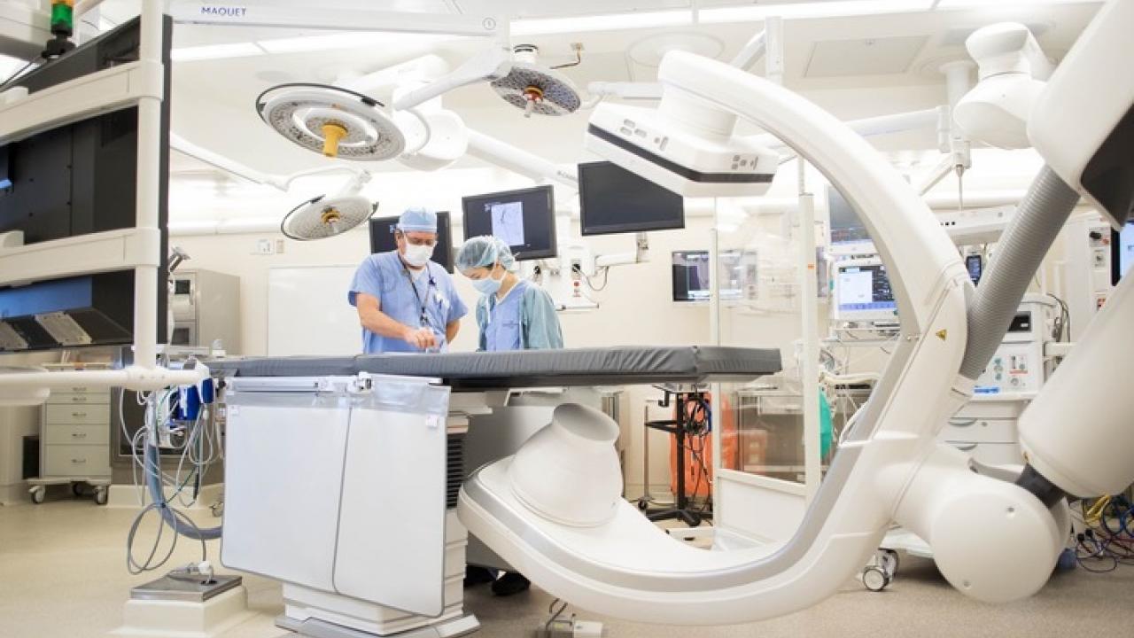 Radiologic technologists check the equipment functions of a new Hybrid OR imaging system on the Parnassus campus. Photo by Susan Merrell.