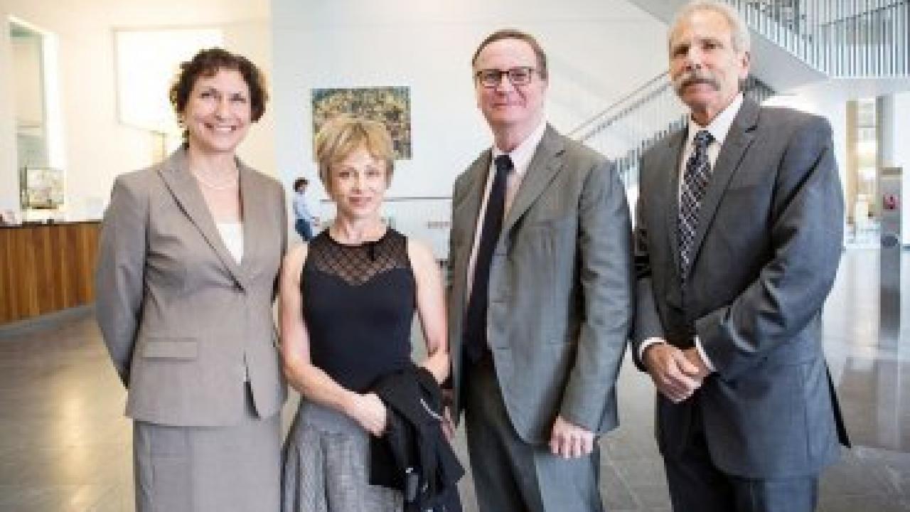 At a March reception honoring donors to the Discovery Fellows Program, from left to right: Elizabeth Watkins, dean of the Graduate Division and vice chancellor of Student Academic Affairs; philanthropist Harriet Heyman; Chancellor Sam Hawgood; and B. Joseph Guglielmo, dean of the School of Pharmacy. Photo by Elisabeth Fall.
