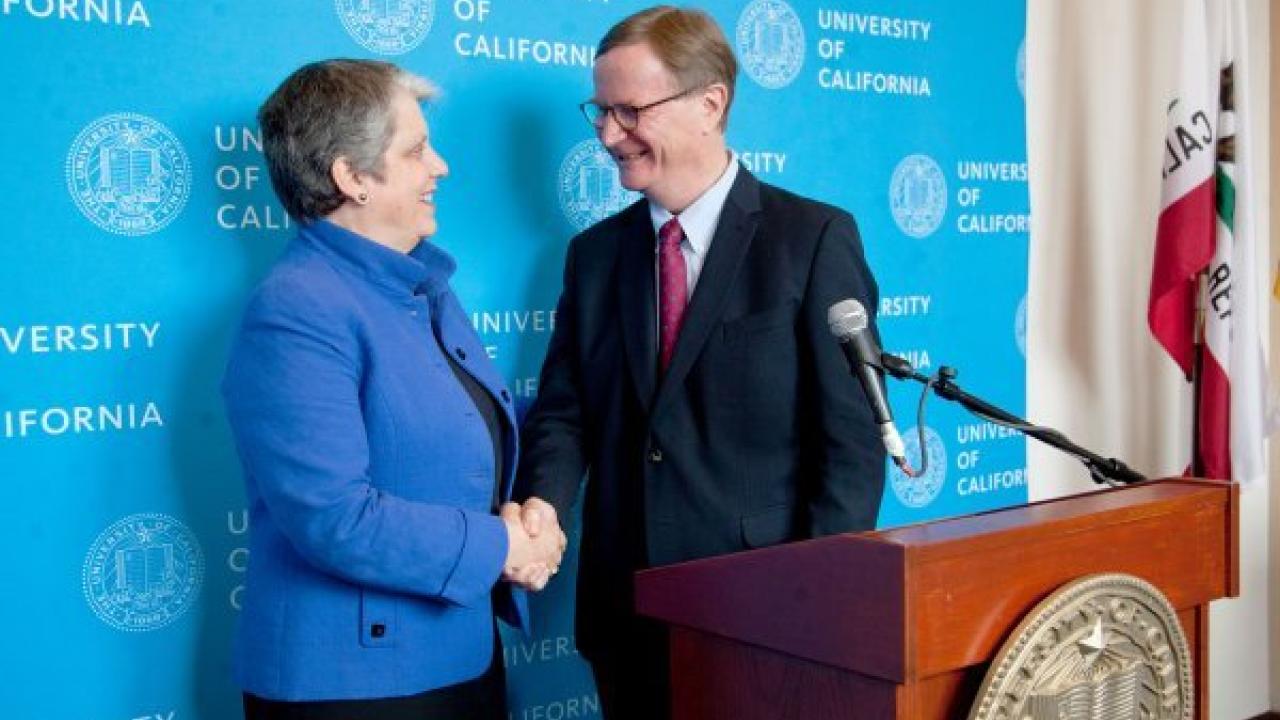UC President Janet Napolitano shakes the hand of the newly confirmed UCSF Chancellor Sam Hawgood, MBBS, at a press briefing after the Board of Regents approved his appointment on July 17. Photo by Cindy Chew