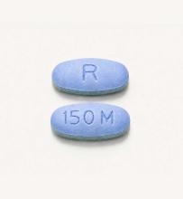 Two daraxonrasib pills, which are blue and oval in shape.