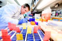 David Solomon, MD, extracts DNA from brain tumor tissue for genomic testing.
