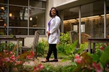 Dermatologist Jenna Lester stands in the garden outside the medical building on the Parnassus Campus of UCSF.