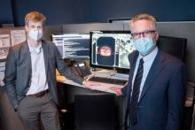 Thomas Hope (left), MD, and Peter Carroll, MD, chair of the Urology Department, stand at the PACS workstation where the images from the PSMA PETs are viewed and interpreted. The new imaging technique received FDA approval. Photo by Maurice Ramirez Peter Carroll Thomas Hope UCSF