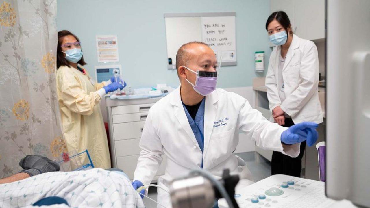Hao Nguyen, MD, PhD, associate professor in the UCSF Department of Urology and the Goldberg-Benioff Endowed Professorship in Cancer Biology, takes an MRI of a prostate via an MRI-ultrasound fusion biopsy. Photo by Susan Merrell Hao Nguyen, UCSF