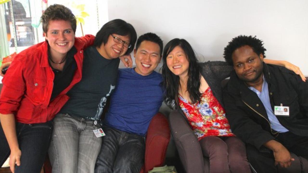 A group of young men of various ages on a couch