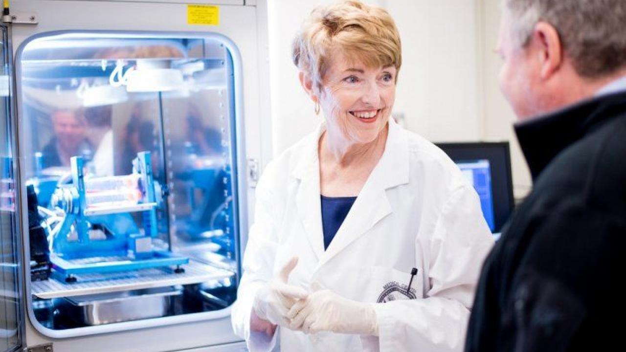 Millie Hughes-Fulford, PhD, speak with Thomas Lang, PhD, in her San Francisco VA Medical Center laboratory in 2016. Photo by Noah Berger Millie Hughes-Fulford