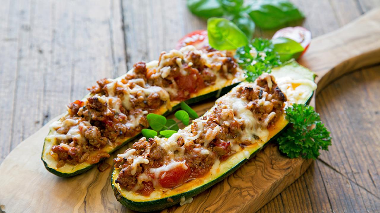 stuffed zucchini served on a cutting board