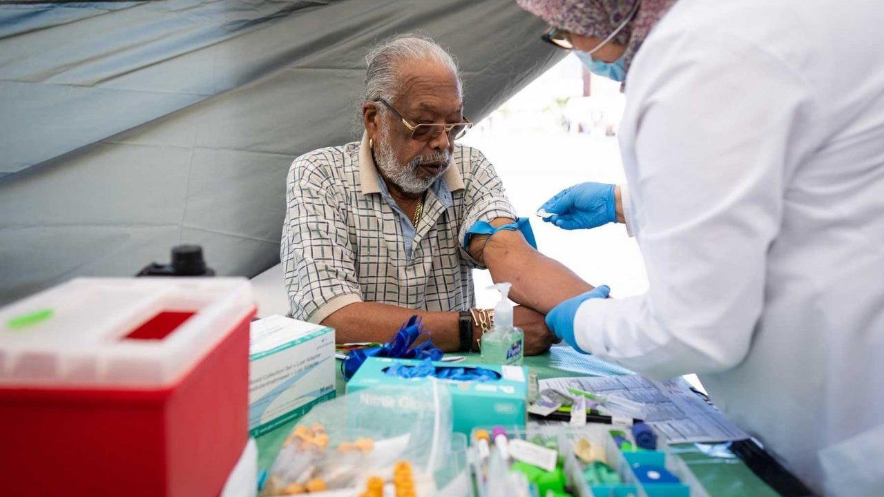 Ray Fisher gets a prostate specific antigen test administered outside the UCSF Helen Diller Family Comprehensive Cancer Center during and SF CAN event in 2022. Photo by Maurice Ramirez