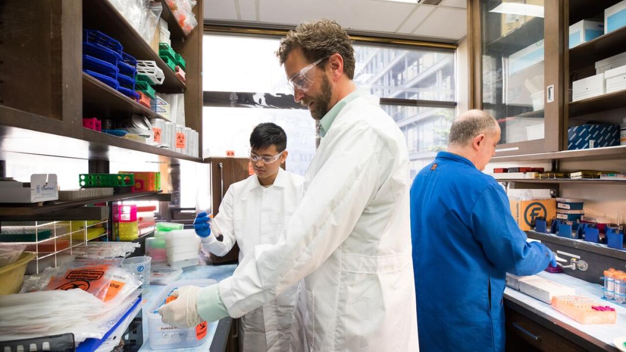 Kord Kober (center) and colleagues conduct research in their lab at the UCSF School of Nursing.