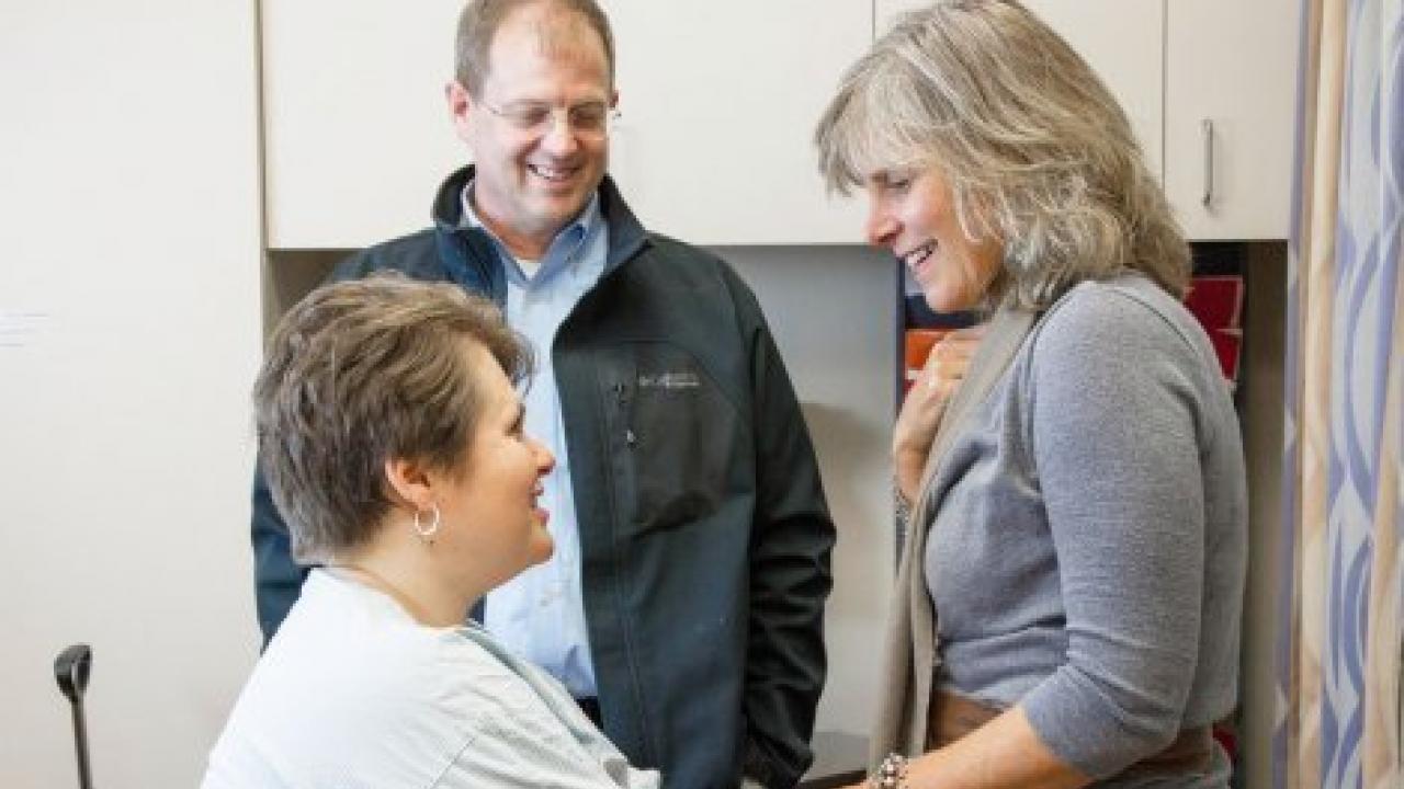 Breast cancer researcher Laura Esserman, MD, MBA, consults with a patient at UCSF. Esserman is leading a new study that will compare a personalized approach to breast cancer screening with annual mammograms. Photo by Susan Merrell