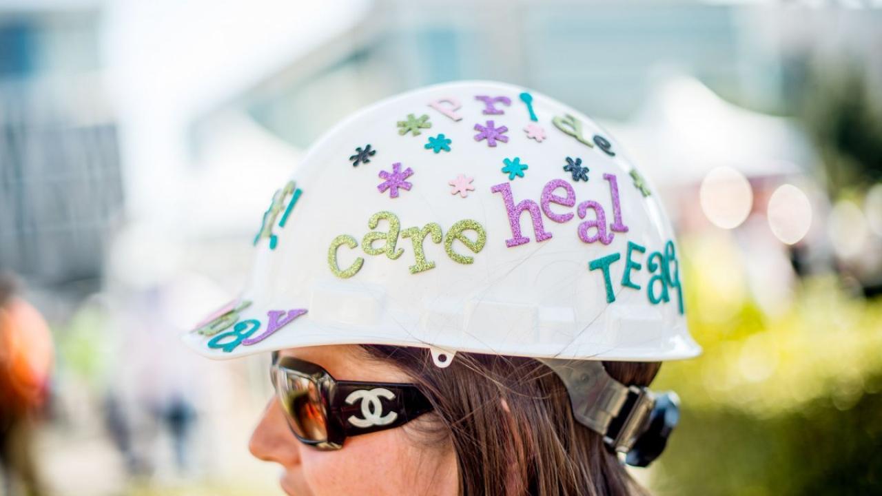 Sheena Fitzpatrick, a front desk supervisor at the UCSF Helen Diller Comprehensive Cancer Center, dons a special hard hat for the 5K walk.