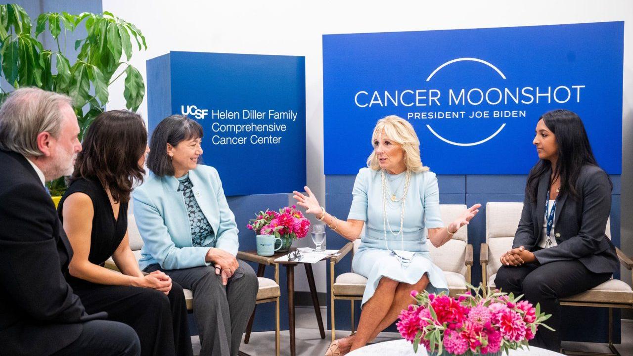 First Lady, Dr. Jill Biden visits UCSF to speak with patients, researchers, and doctors as part of President Biden's Cancer Moonshot program. From left to right: Alan Ashworth, MD, Paola Betancur, MD, Monica Bertagnolli, MD, First Lady Jill Biden, PhD, Kami Pullakhandam. Photo by Noah Berger First Lady, Dr. Jill Biden (center) speaks with cancer researchers. Left to right: Alan Ashworth, MD, Paola Betancur, MD, Monica Bertagnolli, MD, First Lady Jill Biden, PhD, Kami Pullakhandam.