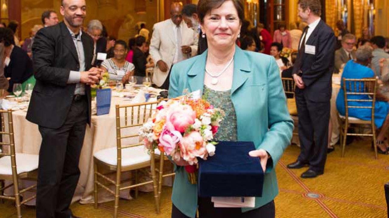 Dr. Rena Pasick at the Women Health Care Executives 2014 Woman of the Year award presentation as UCSF colleague Dr. Mack Roach looks on.