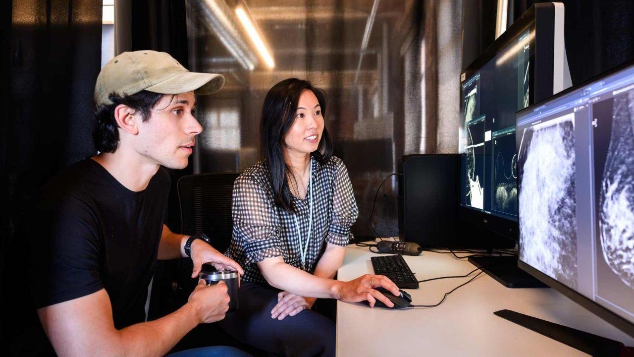 Researchers Adam Yala, PhD (left), and Maggie Chung, MD, co-authors of a study using AI to expedite breast cancer screening for high-risk patients, work in Berkeley on Wednesday, May 20, 2026. Photo by Noah Berger