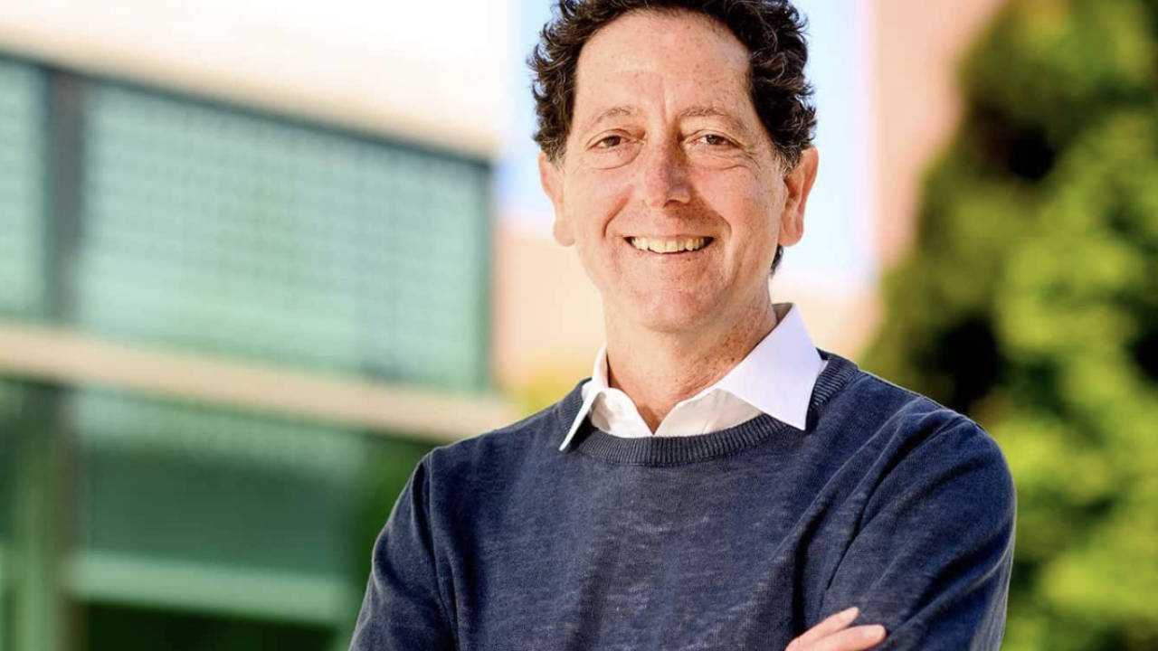 Kevan Shokat stands in front of the Helen Diller Family Comprehensive Cancer Center research building in San Francisco