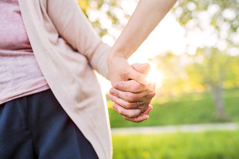 grandmother and granddaughter holding hands