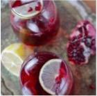 purple beverages in glasses served with lemon slices