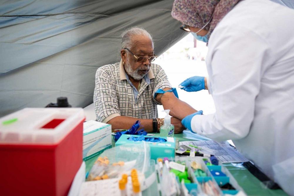 Ray Fisher gets a prostate specific antigen test administered outside the UCSF Helen Diller Family Comprehensive Cancer Center during and SF CAN event in 2022. Photo by Maurice Ramirez