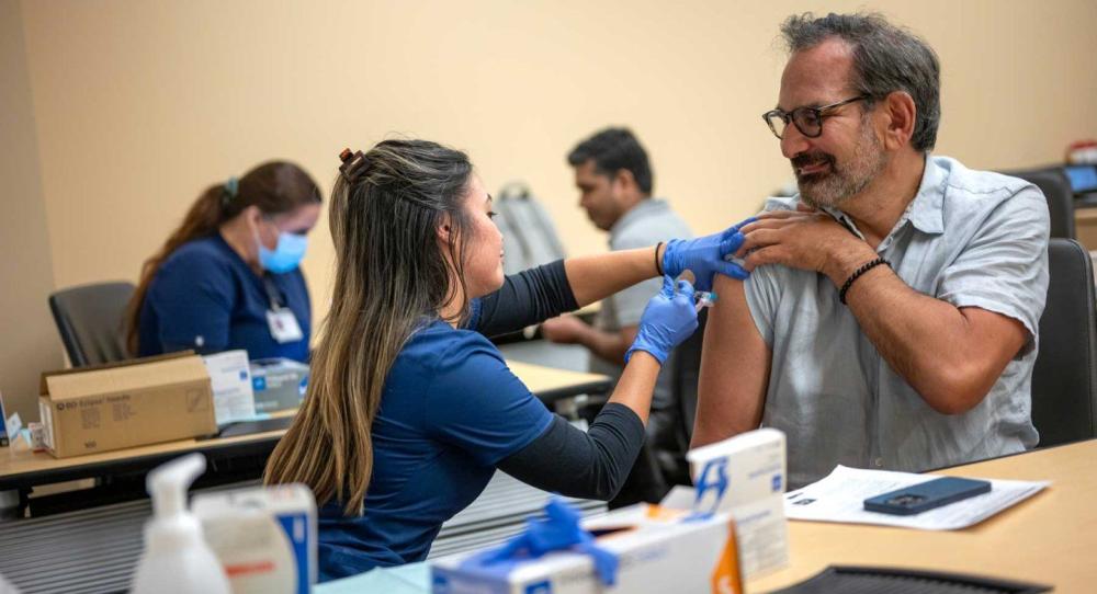 Michael Potter, MD, receives a flu shot at UCSF.