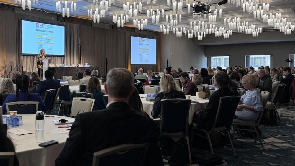 Dr. Laura Esserman addresses attendees at the opening session of the RISE UP Breast Cancer Symposium in San Francisco.