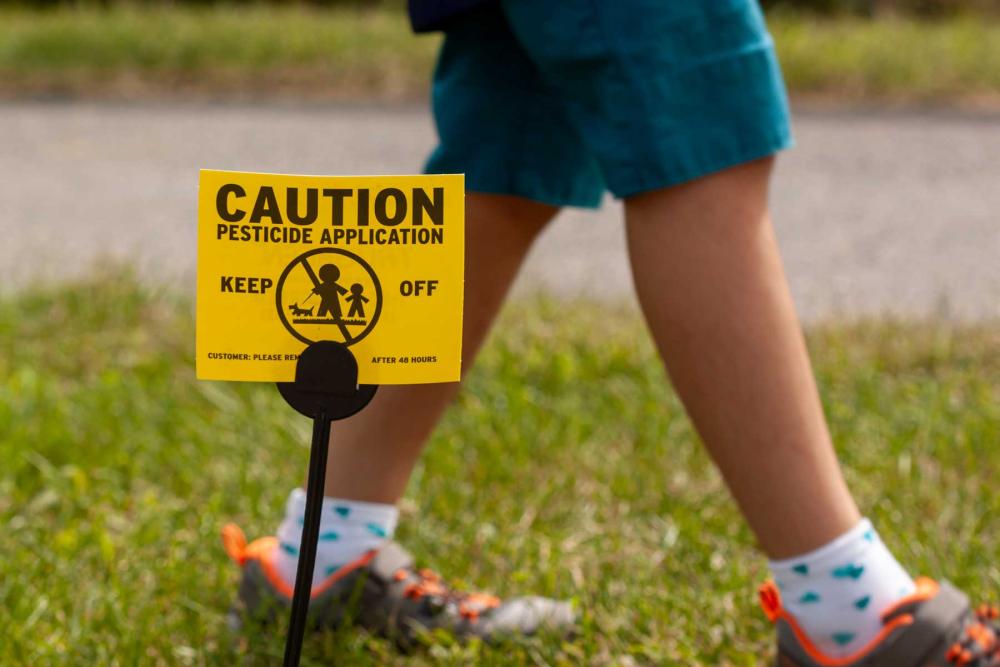 Child Walking by pesticide