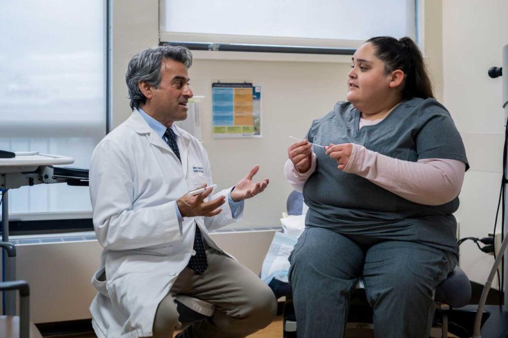 George Sawaya, MD, professor at the UCSF Department of Obstetrics, Gynecology and director of Zuckerberg San Francisco General Hospital and Trauma Center's cervical dysplasia clinic, explains how a self-collectted HPV test works to screen for cervical cancer. Photo by Susan Merrell C