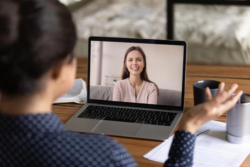 woman conducting a video interview on laptop