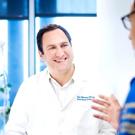 Alex Marson, MD, PhD, UCSF immunologist whose group has developed an approach to edit T-cells directly with CRISPR gene-editing, speaks with MD/PhD student Theo Roth. Credit: Noah Berger.