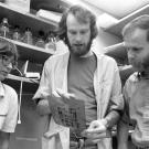 J. Michael Bishop, MD (right), with colleagues in 1989. Photo courtesy of UC San Francisco, Library, University Archives