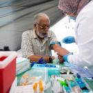 Ray Fisher gets a prostate specific antigen test administered outside the UCSF Helen Diller Family Comprehensive Cancer Center during and SF CAN event in 2022. Photo by Maurice Ramirez