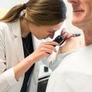 Carina Woodruff, MD, examines a patient during a free skin cancer screening at UCSF. Photo: Barbara Ries