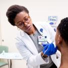 Dr. Jenna Lester, M.D., dermatologist and assistant professor of dermatology, treats her patient Geoffry Blair Hutto in the UCSF Primary Care clinic at China Basin.