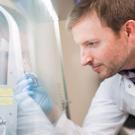 Kole Roybal, associate professor of microbiology and immunology, in his lab at UCSF. 